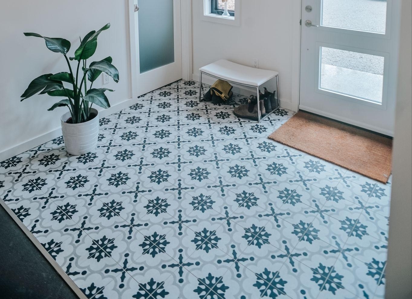 Colourful, patterned floor tile in a home's front entry