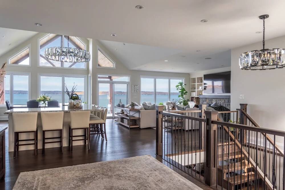 Engineered hardwood flooring in open concept living area of waterfront home