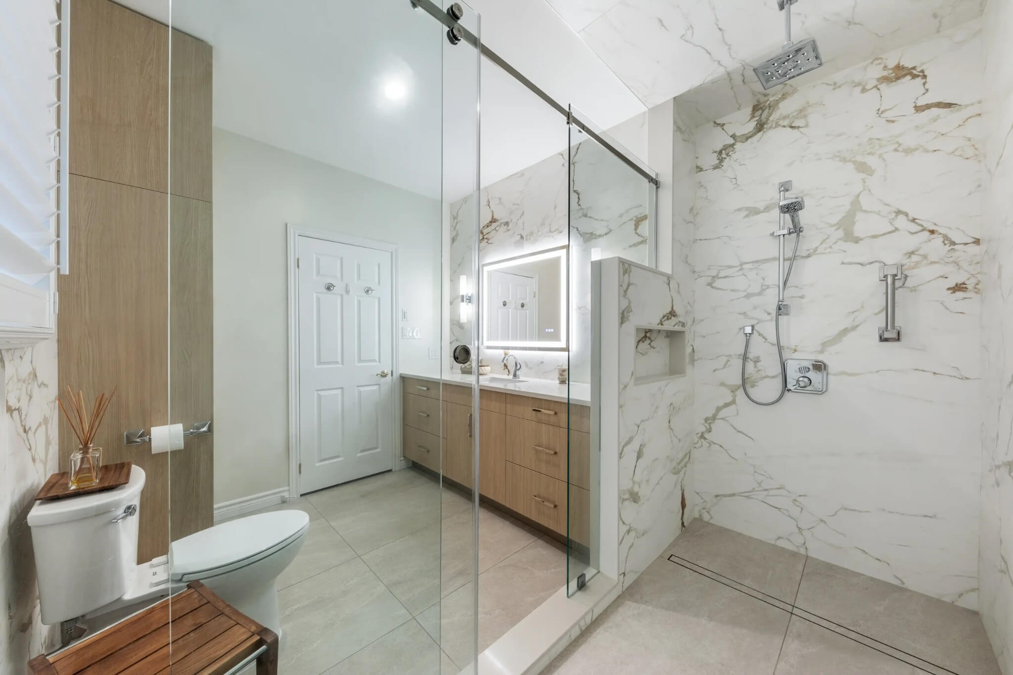 Modern bathroom with walk-in glass shower and a tiled floor